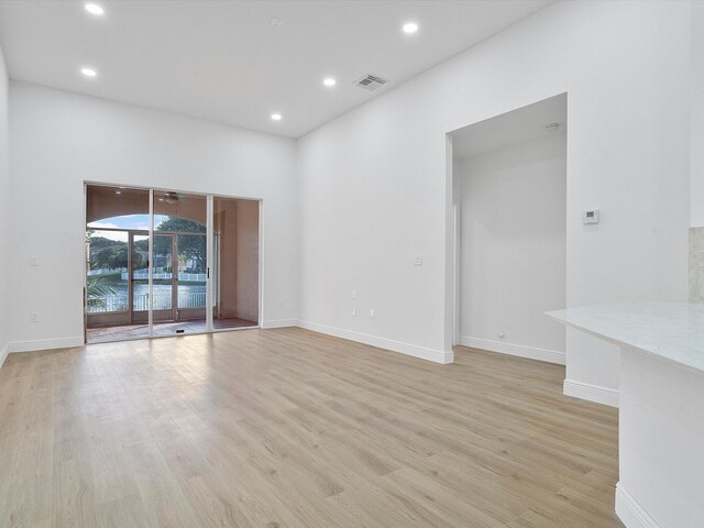 corridor with light wood-type flooring