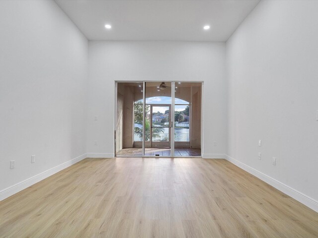 spare room with light hardwood / wood-style flooring and ceiling fan