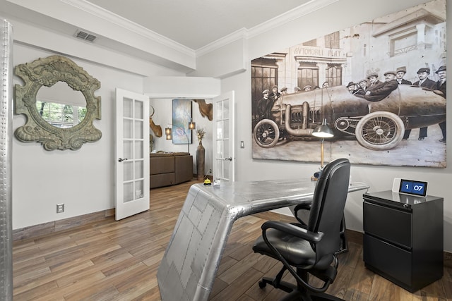 home office featuring french doors, crown molding, and hardwood / wood-style floors