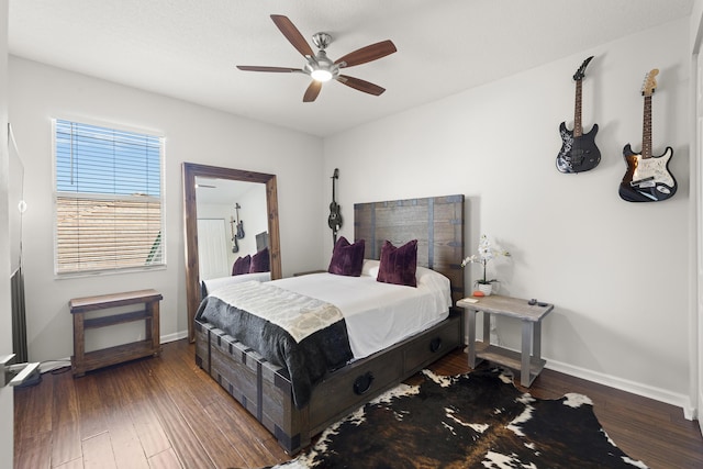 bedroom featuring ceiling fan and dark hardwood / wood-style floors