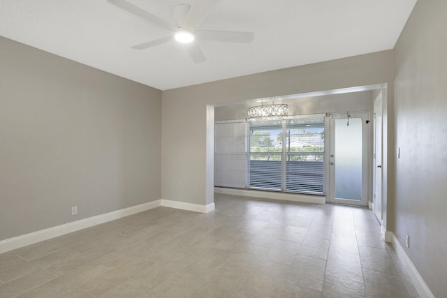 unfurnished room with ceiling fan