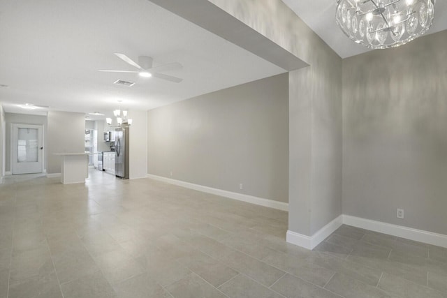 unfurnished living room with light tile patterned floors and ceiling fan with notable chandelier