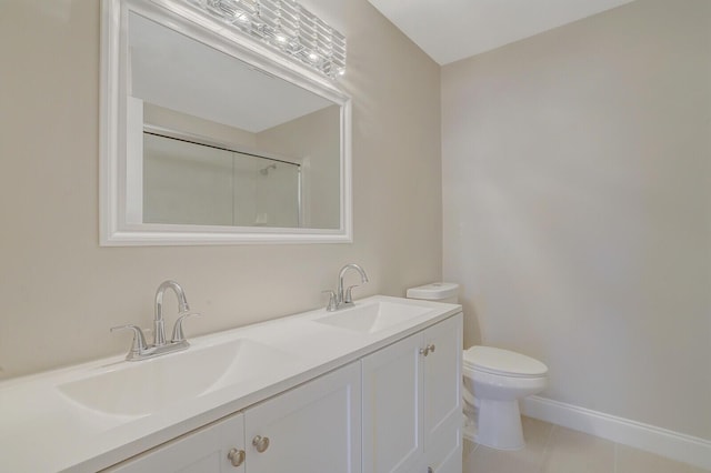 bathroom featuring tile patterned flooring, vanity, toilet, and an enclosed shower