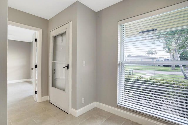 interior space featuring light tile patterned floors