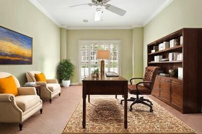 office featuring light colored carpet, ceiling fan, and crown molding