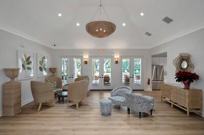 living room featuring crown molding, french doors, and light hardwood / wood-style flooring