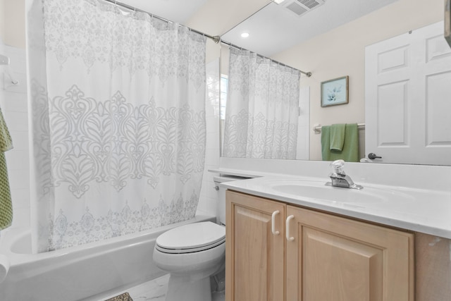 full bathroom featuring vanity, shower / bath combination with curtain, and toilet