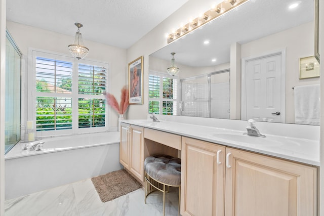 bathroom featuring a chandelier, a textured ceiling, vanity, and separate shower and tub