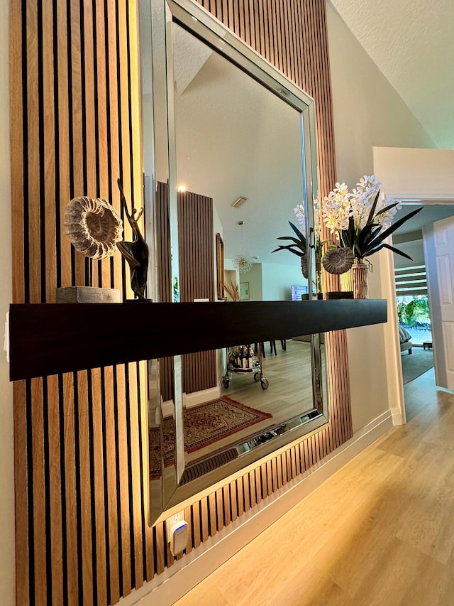 interior details with hardwood / wood-style flooring and a textured ceiling