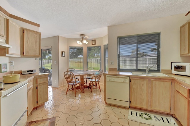 kitchen with sink, white appliances, light tile patterned floors, a notable chandelier, and light brown cabinetry