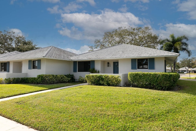 ranch-style house featuring a front lawn