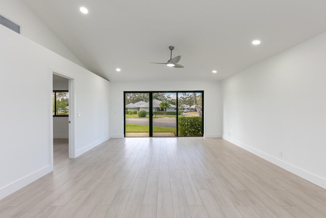 unfurnished room with light wood-type flooring, ceiling fan, and lofted ceiling