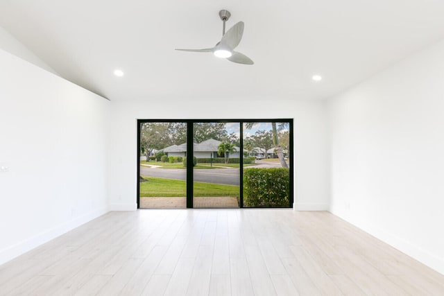 unfurnished room featuring ceiling fan and light hardwood / wood-style floors