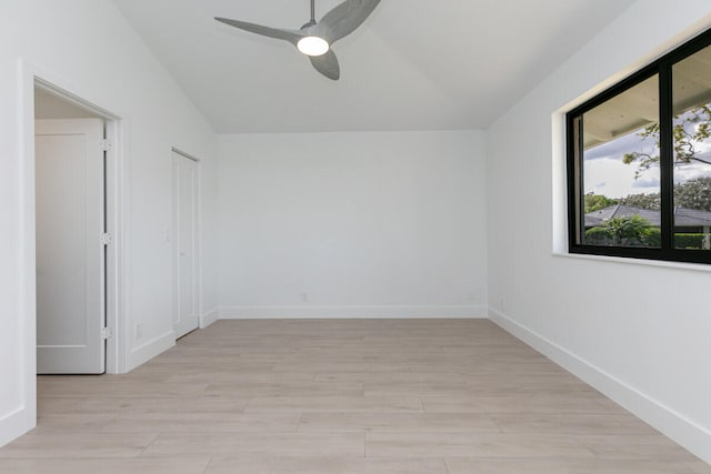 empty room featuring light hardwood / wood-style flooring and ceiling fan