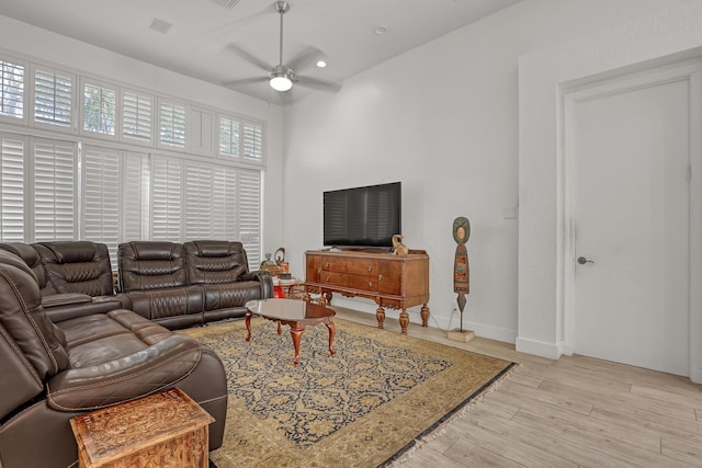 living room with recessed lighting, baseboards, ceiling fan, and wood finished floors