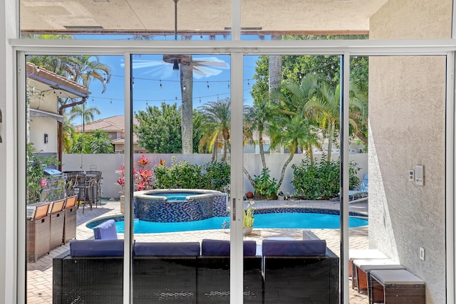 view of swimming pool featuring ceiling fan