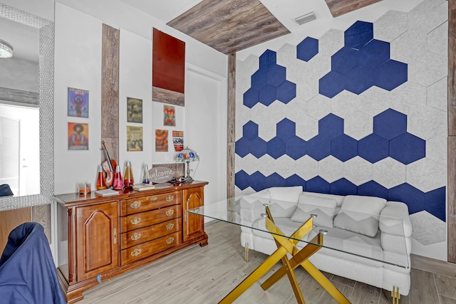 sitting room featuring light wood finished floors and visible vents