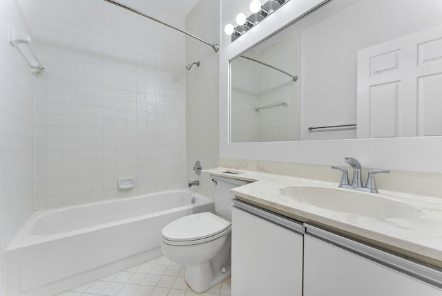 full bathroom with tile patterned floors, vanity, toilet, and tiled shower / bath combo