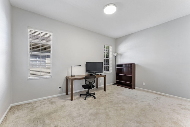 carpeted office space featuring plenty of natural light