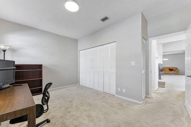 office area featuring light carpet