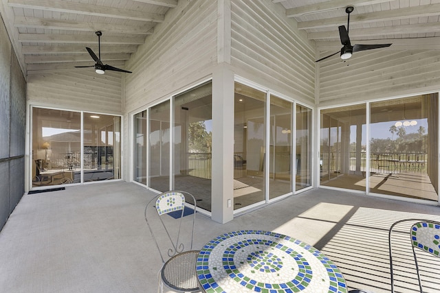 sunroom featuring vaulted ceiling with beams, ceiling fan, and wood ceiling