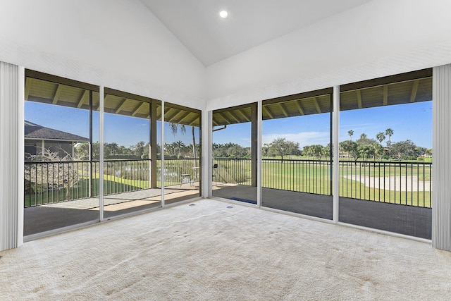 unfurnished sunroom featuring a water view and vaulted ceiling