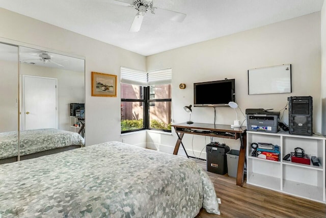 bedroom featuring wood-type flooring, a closet, and ceiling fan