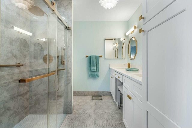 bathroom featuring vanity and a shower with shower door