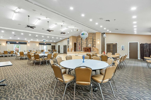 carpeted dining area with ceiling fan