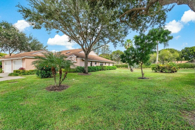 view of yard with a garage