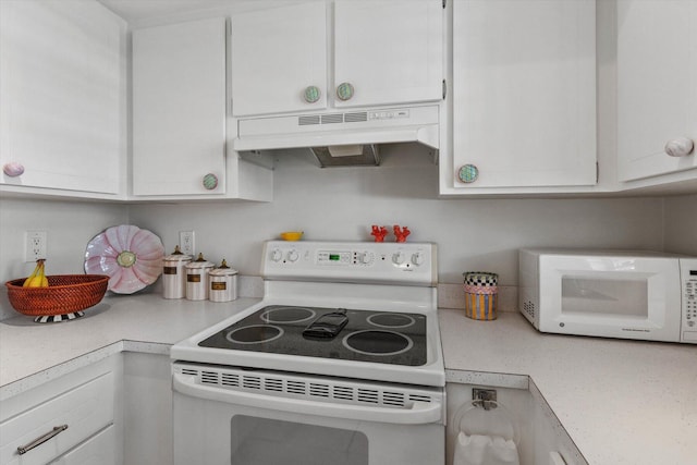 kitchen featuring white cabinets and white appliances