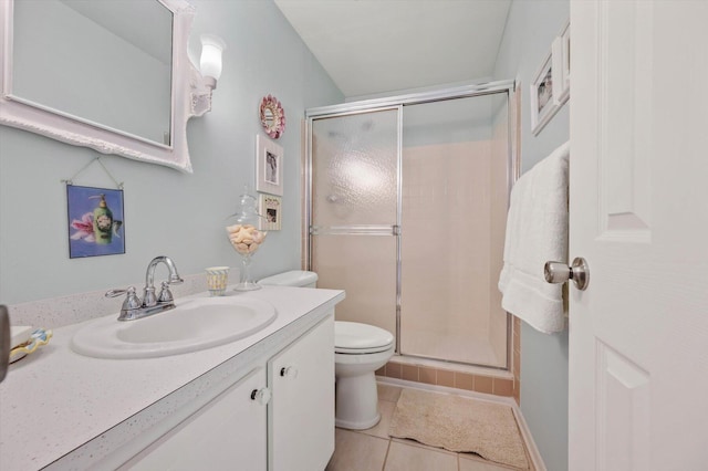 bathroom with tile patterned floors, toilet, an enclosed shower, and vanity