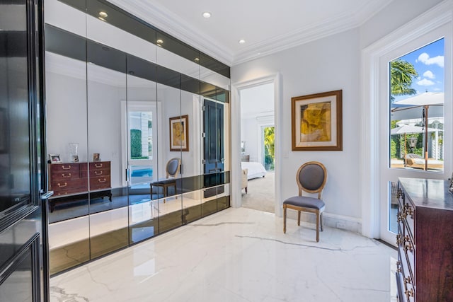 interior space featuring baseboards, marble finish floor, plenty of natural light, and crown molding