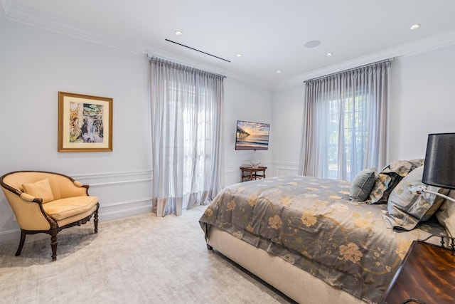 bedroom featuring light colored carpet and crown molding