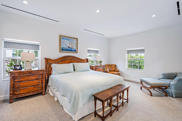 bedroom featuring recessed lighting, light colored carpet, and baseboards