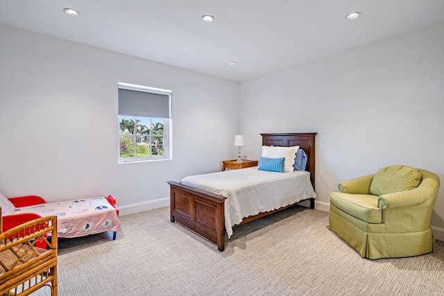 bedroom featuring light carpet, recessed lighting, and baseboards