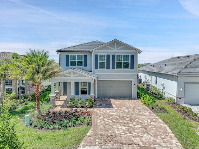 view of front of home featuring a porch and a garage