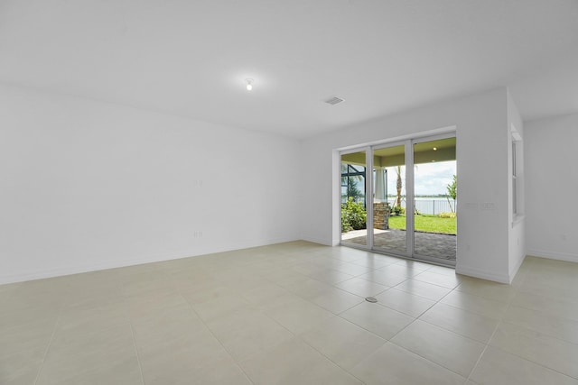 spare room with light tile patterned floors