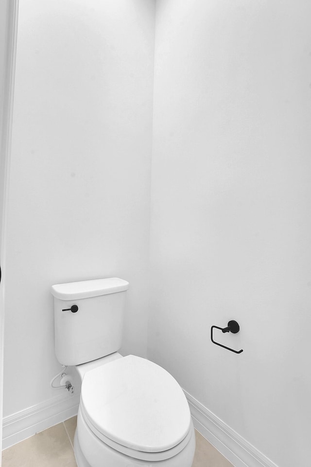 bathroom featuring tile patterned flooring and toilet