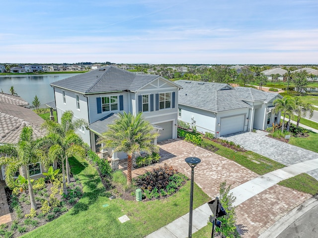 view of front of home featuring a water view and a garage