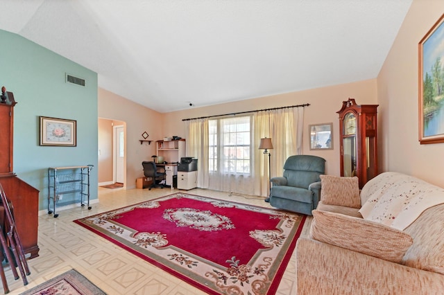 living room featuring lofted ceiling