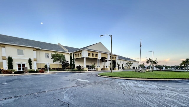 view of outdoor building at dusk