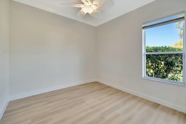 spare room featuring light wood-type flooring and ceiling fan