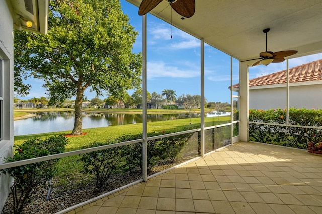 unfurnished sunroom with a water view