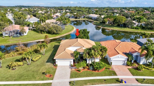 birds eye view of property with a water view