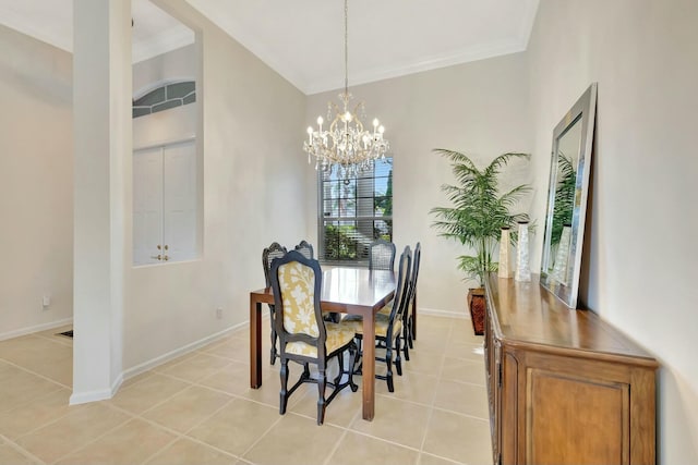 dining area with light tile patterned floors, ornamental molding, and a chandelier