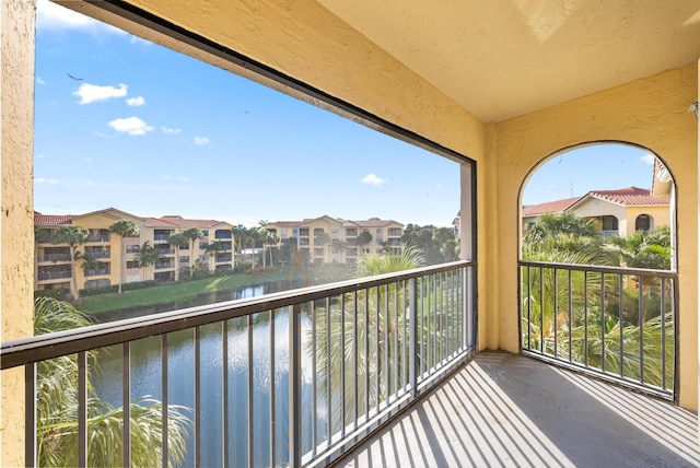 balcony featuring a water view