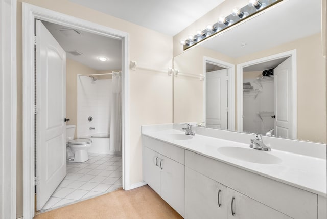 full bathroom with tile patterned floors, shower / bath combo with shower curtain, vanity, and toilet