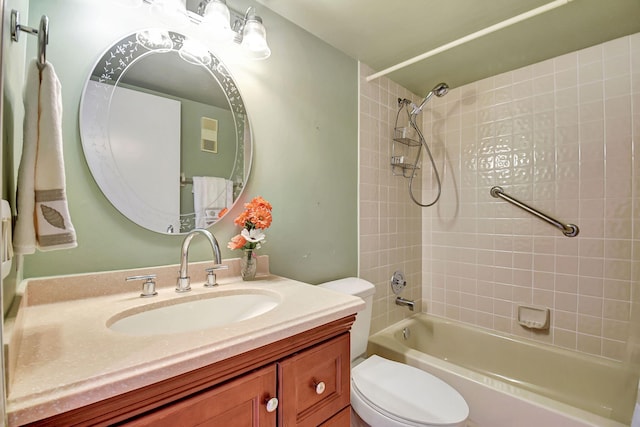 full bathroom with vanity, toilet, and tiled shower / bath