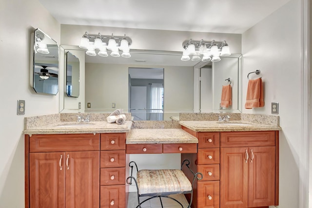 bathroom featuring ceiling fan, tile patterned flooring, and vanity